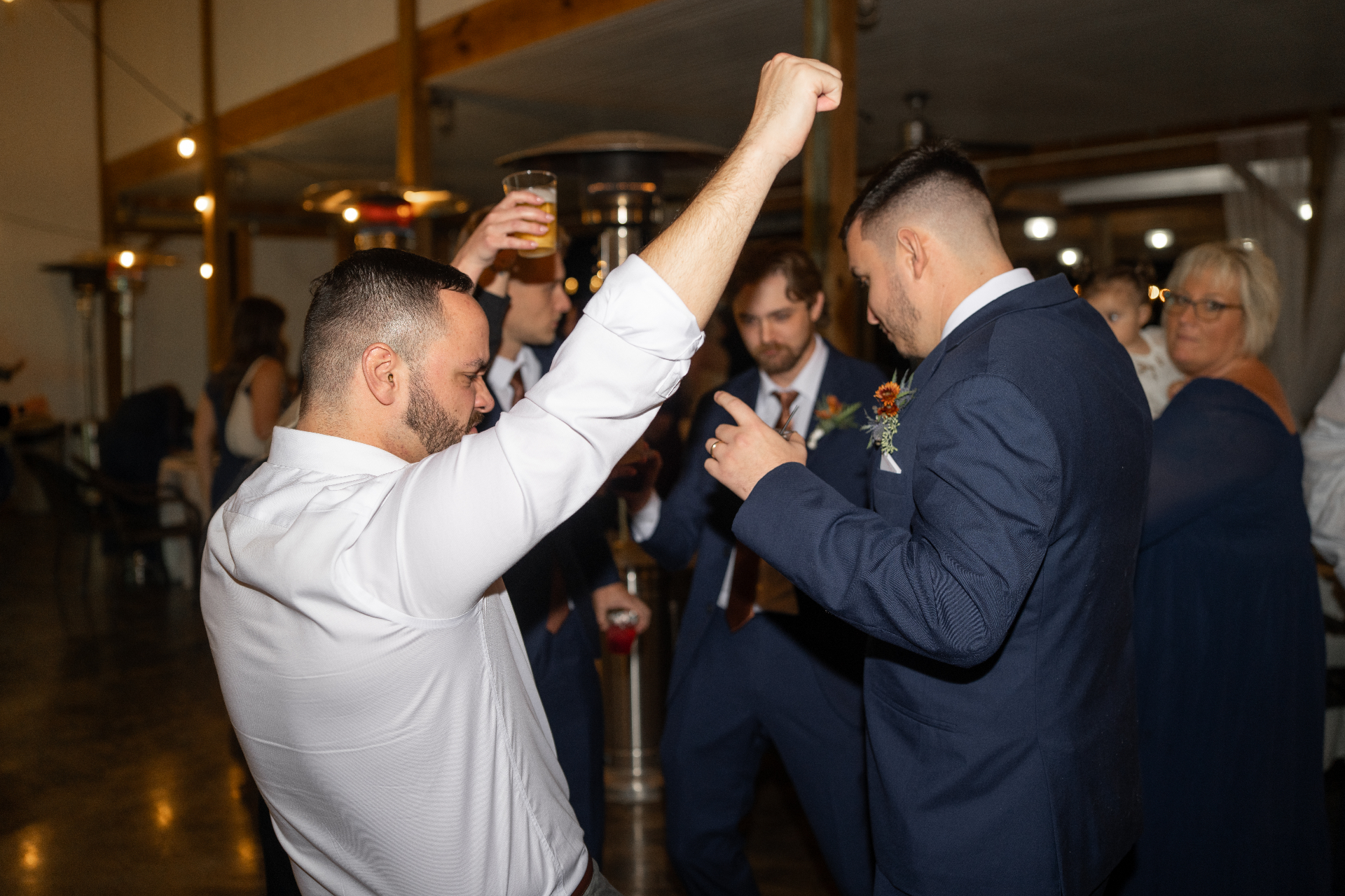 Wedding DJ services — couple's first dance lit by stage lights